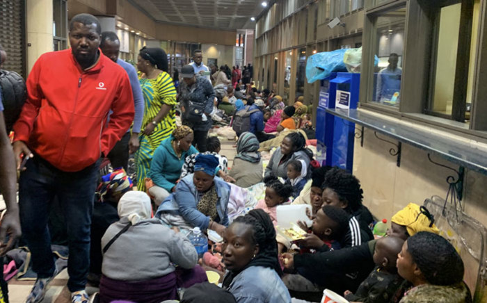 Foreign nationals wait at the UN Refugee Agency office in Cape Town for assistance in leaving South Africa on 9 October 2019. Picture: Kaylynn Palm/EWN
