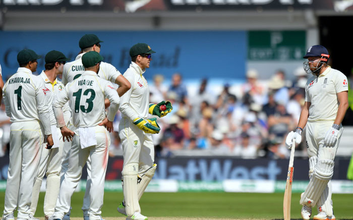 England's Jonny Bairstow (R) stands by as Australia's captain Tim Paine (2nd R) has a word on the fourth day of the third Ashes cricket Test match between England and Australia at Headingley in Leeds, northern England, on 25 August 2019. Picture: AFP