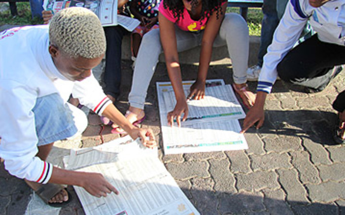 FILE: Soweto students search for matric results in the newspaper. Picture: Eyewitness News
