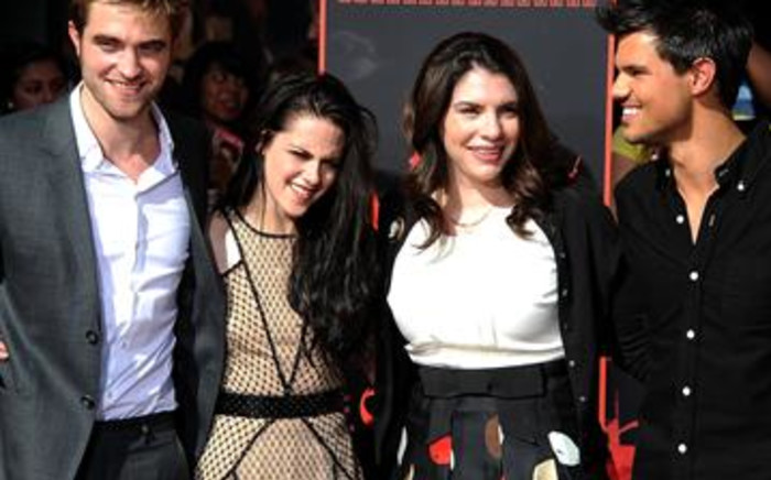 Actors Robert Pattinson, Kristen Stewart and Taylor Lautner with The Twilight Saga author Stephenie Meyer. Picture: Valerie Macon/AFP