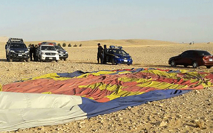 The remains of a hot air balloon are seen on the ground near the ancient city of Luxor after a fatal crash on 5 January 2018. Picture: AFP