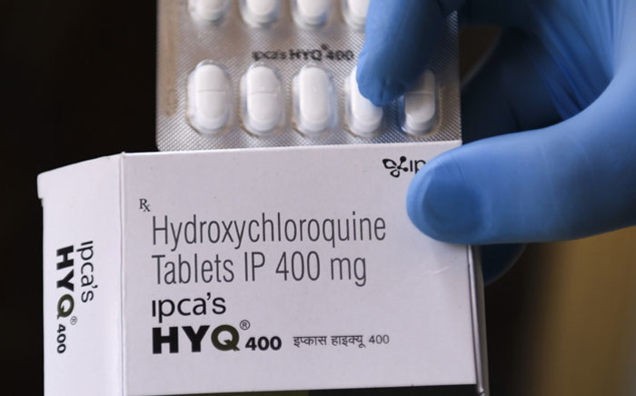 In this file photo taken on April 26, 2020 a vendor shows hydroxychloroquine (HCQ) tablets at a pharmacy in Amritsar, India. Picture: AFP