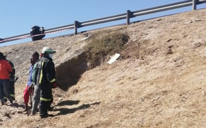 A fireman surveys the area where four children fell into a hole while playing on sand dunes near the N2 Borcherds Quarry intersection in Gugulethu on 8 February 2021. Picture: Supplied