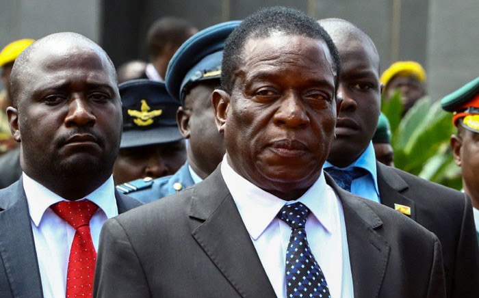 This file photo taken on 7 January, 2017 shows Emmerson Mnangagwa (C) attending the funeral ceremony of Peter Chanetsa at the National Heroes Acre in Harare. Picture: AFP