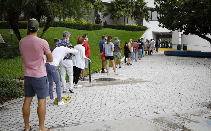 In this photo taken on 19 October 2020, voters wait in line to cast their early ballots at Miami Beach, Florida, City Hall. Picture: AFP