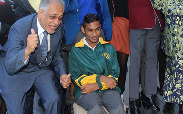 Joshua Chetty (seated) is one of the country's top matric achievers for the class of 2017. Picture: @DBE_SA/Twitter