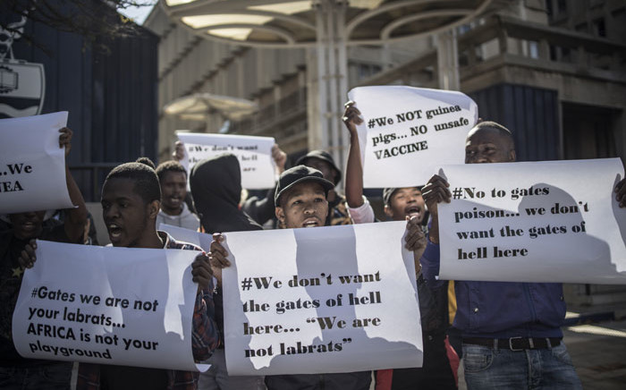 A group of protesters of the #NoToVaccination group gather outside the University of the Witwatersrand in Johannesburg, on 1 July 2020 for a protest against the coronavirus vaccine trials in Africa. Picture: AFP