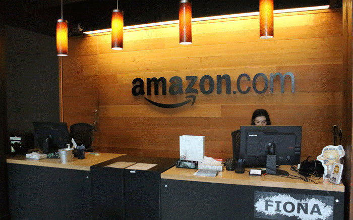 FILE: Nikol Szymul staffs a reception desk at Amazon offices discretely tucked into a building called Fiona in downtown Seattle, Washington on 11 May 2017. Picture: AFP.