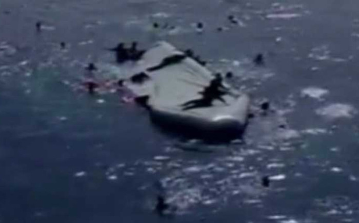 An inflatable boat capsizes in the Mediterranean Sea, killing forty migrants. Fifty-five were rescued. Picture: CNN
