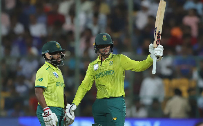 South Africa's Quinton de Kock (right) raises his bat after scoring a 50 in the Twenty20 International match against India on 22 September 2019. Picture: @BCCI/Twitter