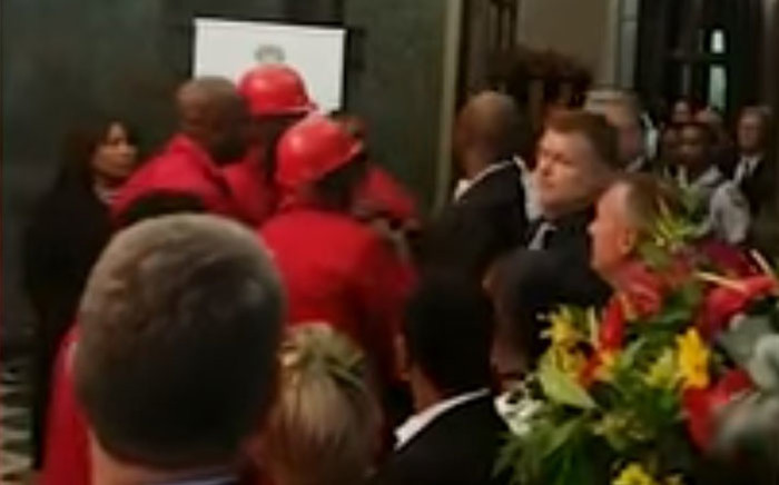 A screengrab of EFF MPs confronting Parliament security staff after President Cyril Ramaphosa's State of the Nation Address on 7 February 2019.