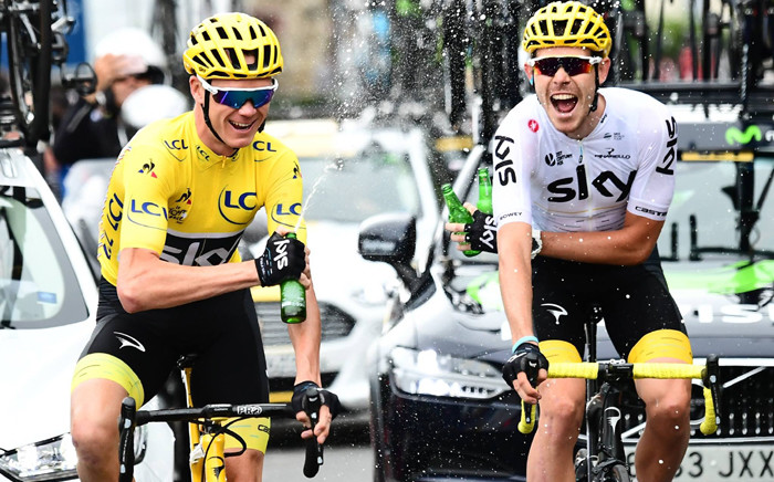 Chris Froome, left, wearing the overall leader's yellow jersey, wins the Tour de France 2017. Picture: Twitter/ @LeTour.