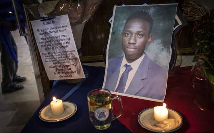 FILE: A picture of Mondeor High School pupil Kulani Mathebula is seen in front of candles during a memorial service. Picture: Abigail Javier/EWN.