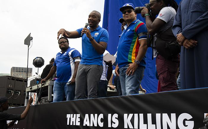 DA members in front of a newly unveiled billboard in Johannesburg on 16 January 2019. Picture: Kayleen Morgan/EWN