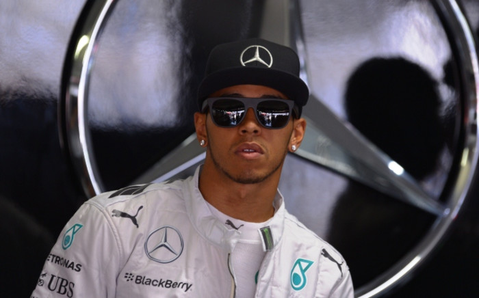 FILE:Mercedes-AMG's British driver Lewis Hamilton reacts before his crash during the qualifying session ahead of the German Formula One Grand Prix at the Hockenheimring racing circuit in Hockenheim, southern Germany, on 19 July 2014. Picture: AFP.