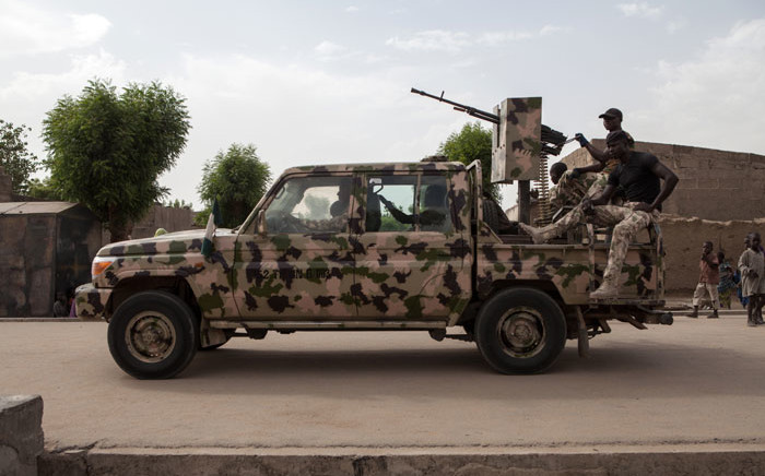 FILE: A Nigerian army vehicle patrols in the town of Banki in northeastern Nigeria on 26 April, 2017. Picture: AFP