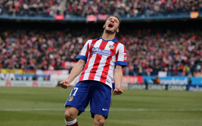  Atletico Madrid’s midfielder Saul Niguez celebrates after scoring his team’s second goal during the Spanish league football match Club Atletico de Madrid vs Real Madrid CF at the Vicente Calderon stadium in Madrid on 7 February, 2015. Picture: AFP