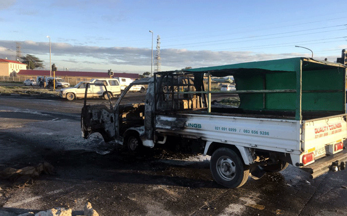 A municipal truck was torched during a protest  in Gugulethu, on 25 May 2018. Picture: Shamiela Fisher/EWN