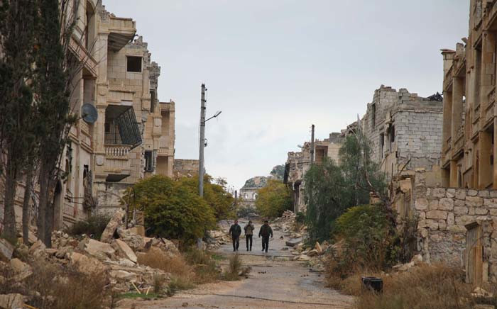 FILE: Syrian rebel-fighters from the National Liberation Front (NLF) patrol an area near the frontline in the rebel-held al-Rashidin district of western Aleppo's countryside near Idlib province, on 26 November 2018. Picture: AFP