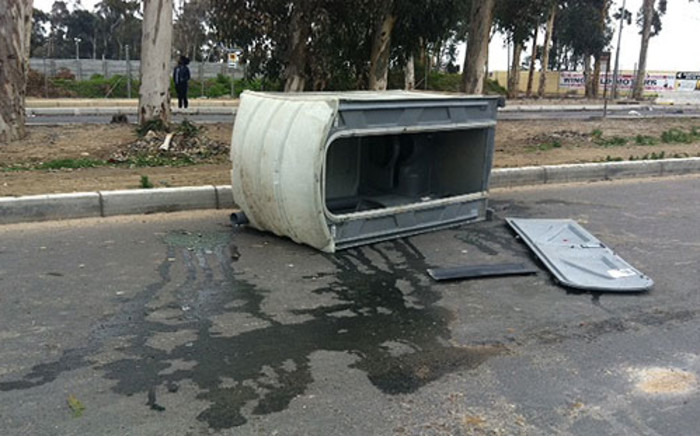 Du Noon residents overturned a portable toilet during a service delivery protest on 26 July 2013. Picture: Lauren Isaacs/EWN