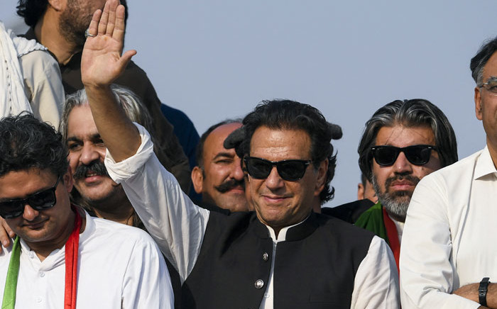 Ousted Pakistan's prime minister Imran Khan (C) waves at his party supporters during a rally in Islamabad on 26 May 2022. Picture: Aamir QURESHI/AFP