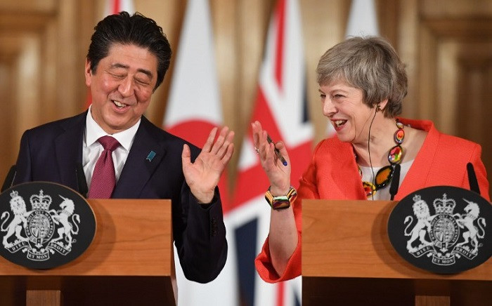 British Prime Minister Theresa May (R) and Japan's Prime Minister Shinzo Abe (L) hold a joint press conference at 10 Downing Street in central London on 10 January 2019 following talks. Picture: AFP