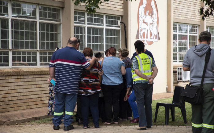 Parents, teachers and community members gather outside Hoërskool Driehoek in Vanderbijlpark where a structural collapse killed at least three children and injured over 20 others on 1 February 2019. Picture: Christa Eybers/EWN