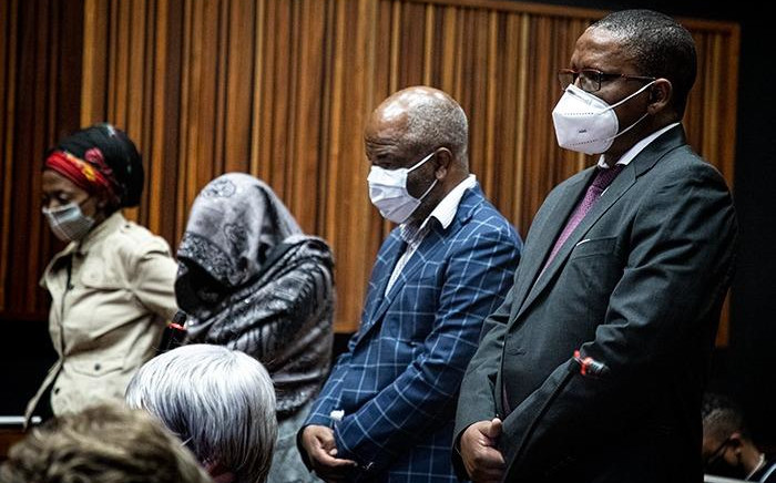 Sybil Ngcobo, Mmakgosi Mosupi, Valdis Romaano and Obakeng Mookeletsi appear at the Palm Ridge Magistrates Court on 22 October 2020 on corruption charges. Picture: Xanderleigh Dookey/EWN