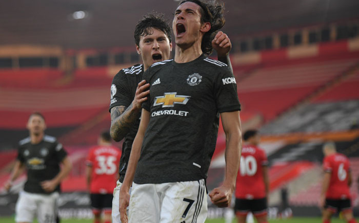 Manchester United striker Edinson Cavani (R) celebrates scoring their second goal with teammate Victor Lindelof during the English Premier League football match between Southampton and Manchester United at St Mary's Stadium in Southampton, southern England on 29 November 2020. Picture: AFP