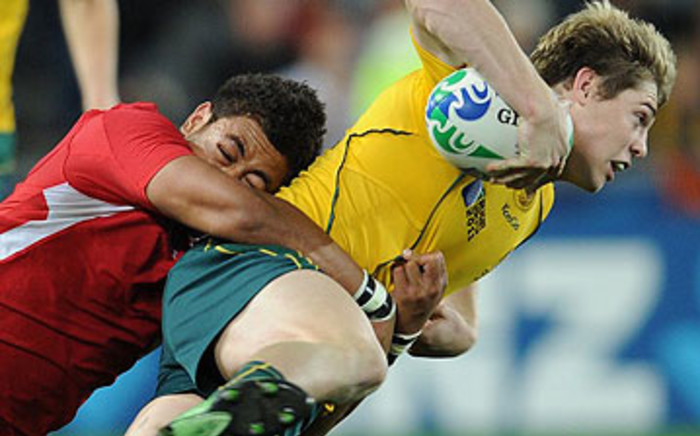 Wallabies wing James O'Connor (R) is tackled by Wales' flanker Toby Faletau during the 2011 Rugby World Cup bronze final match on October 21, 2011. Picture: AFP