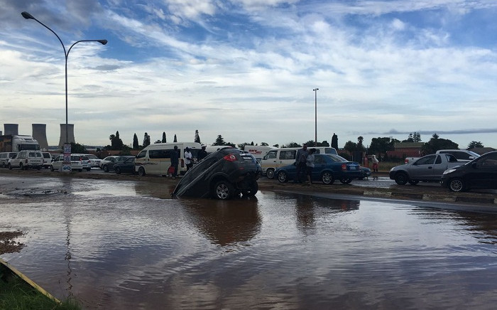 Car stuck in a sinkhole in Kempton Park on 13 December 2016. Picture: Supplied.