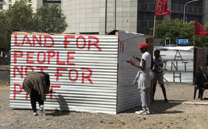 Social housing lobby group Reclaim The City occupies a piece of land on the Foreshore in Cape Town’s CBD on 4 December 2018 in protest over the sale of the land. Picture: Kevin Brandt/EWN
