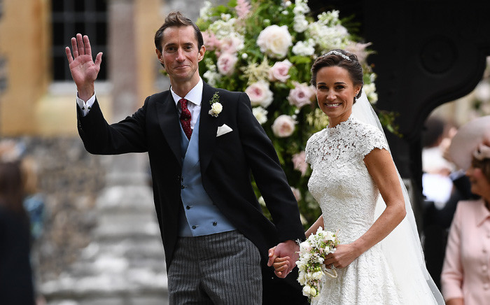 Pippa Middleton and her new husband James Matthews leave St Mark's Church in Englefield on 20 May 2017 following their wedding ceremony. Picture: AFP.