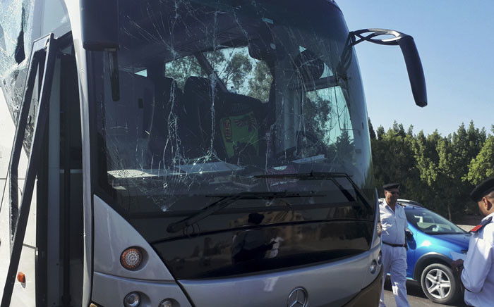 A picture taken on 19 May 2019, shows a bus damaged during a bomb blast near Egypt's famed Giza pyramids. Picture: AFP