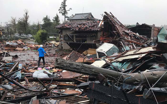 Damaged houses caused by weather patterns from Typhoon Hagibis are seen in Ichihara, Chiba prefecture on 12 October 2019. Powerful Typhoon Hagibis on 12 October claimed its first victim even before making landfall, as potentially record-breaking rains and high winds sparked evacuation orders for more than a million people. Picture: AFP