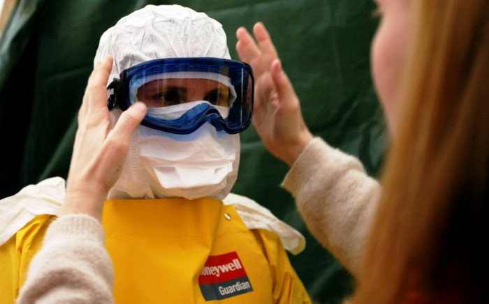 Health workers of the International Federation of Red Cross (IFRC) and Medical charity Medecins Sans Frontieres (MSF) take part in a pre-deployment training for staff heading to Ebola-affected countries, at the headquarters of the International Federation of Red Cross and Red Crescent Societies (IFRC), in Geneva, Switzerland, 4 November 2014. Picture: EPA.