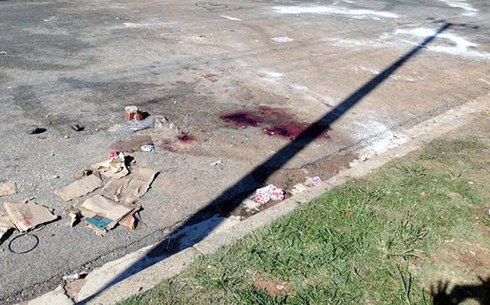 FILE: Blood stains on the street where one of the two bodies were found in Langlaagte last night in another violent attack linked to the Soweto looting on 26 January 2015. Picture: Gia Nicolaides/EWN.