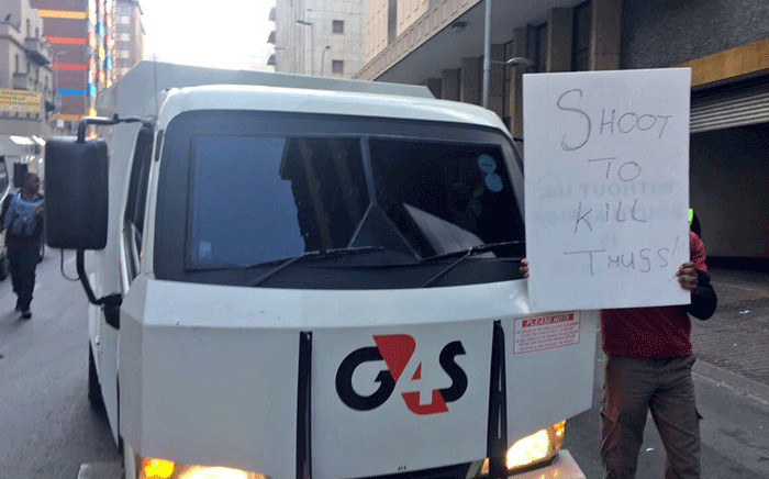 Security workers and G4S vans seen during a protest in Johannesburg against cash-in-transit heists on 12 June 2018. Picture: Katleho Sekhotho/EWN