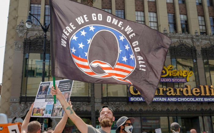 This file photo taken on August 22, 2020 shows demonstrators from conspiracy theorist group QAnon protesting against child trafficking at a demonstration on Hollywood Boulevard in Los Angeles, California. Picture: Kyle Grillot / AFP