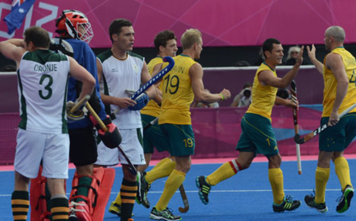 Australia's players celebrate scoring a goal against South Africa during their London 2012 Olympic Games. Picture: AFP.