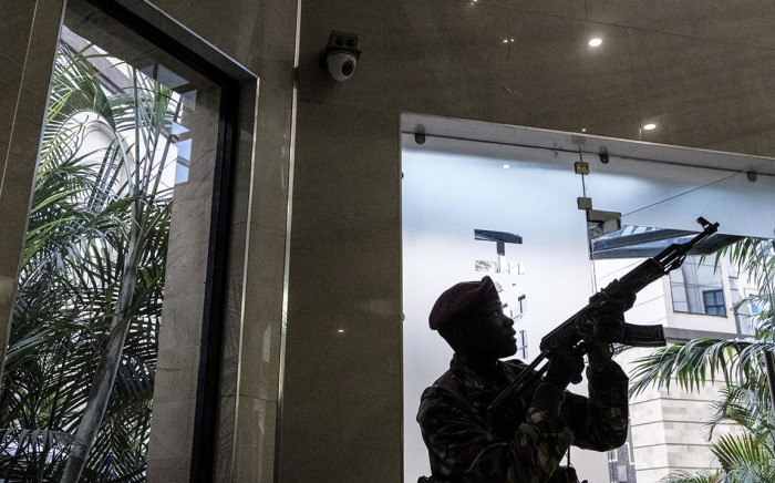 A security officer secures the building attached to the DusitD2 hotel in Nairobi, on January 15, 2019, after a blast followed by a gun battle rocked the upmarket hotel complex. Picture: AFP