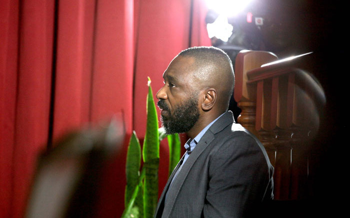FILE: In this photo taken on 9 December 2019 Jose Filomeno dos Santos (L), the son of former Angolan President Jose Eduardo dos Santos, appears in the high court on corruption charges in Luanda. Picture: AFP