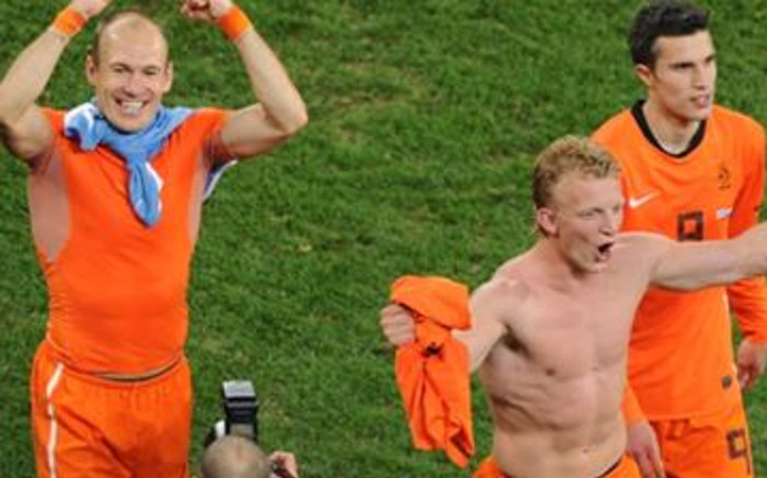Netherlands players Arjen Robben (L), Dirk Kuyt (C) and Nigel de Jong celebrate after qualifying for the 2010 World Cup final. Picture: AFP