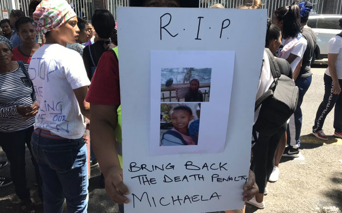 FILE: A community member holds a poster outside of court on 14 January 2020, calling for the return of the death penalty after Michaela Williams, 12, was raped and murdered by a repeat offender. Picture: Lauren Isaacs/Eyewitness News