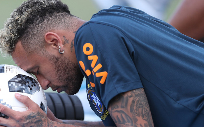 FILE: Brazil forward Neymar resting his head on a ball during a training session. Picture: @CBF_Futebol/Twitter