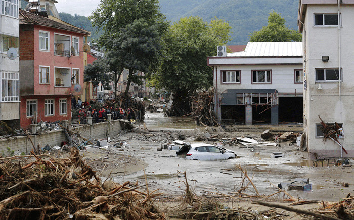 This handout picture released by Turkey's IHH humanitarian aid group on 12 August 2021 shows a car floating in water in Kastamonu, after flash floods swept across several Black Sea regions. Picture:
Handout / IHH / AFP.
