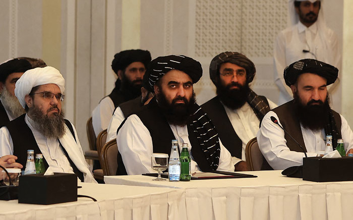 Members of the Taliban delegation Shahabuddin Delawar (L), Amir Khan Muttaqi, and Khairullah Khairkhwa (R) meet with foreign diplomats in Qatar's capital Doha, on 12 October 2021. Picture: KARIM JAAFAR/AFP