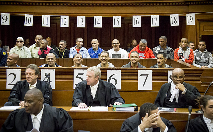 FILE: An alleged leader of the 28s gang, George Thomas, and his 16 co-accused in court on 4 May 2015. Picture: Thomas Holder/EWN.