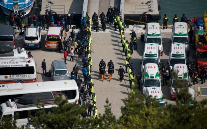 FILE: A general view shows the arrival of the bodies of victims of the South Korean ferry at Jindo harbour on 21 April. Picture: AFP