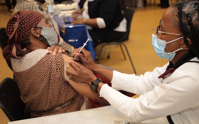 FILE: An elderly woman receives her COVID-19 vaccine jab with the start of the second phase of South Africa's vaccine rollout on 17 May 2021. Picture: @GautengHealth/Twitter